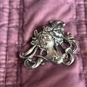 Silver Art Nouveau Brooch on Pink Quilted Fabric